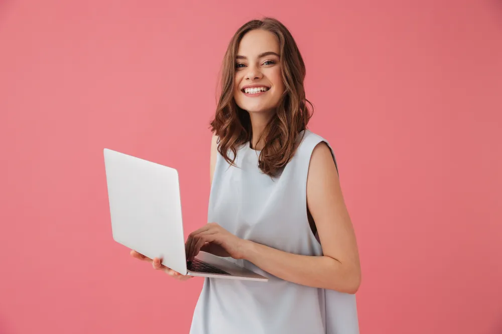 Image,of,cheerful,young,woman,standing,isolated,over,pink,background